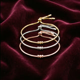 Pulseira arco em dourado, prateado e rosé