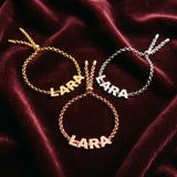 Pulseira com nome em dourado, prateado e rosé